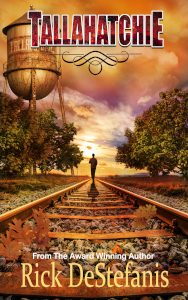 Tallahatchie Book cover man walking near railroad tracks southern town